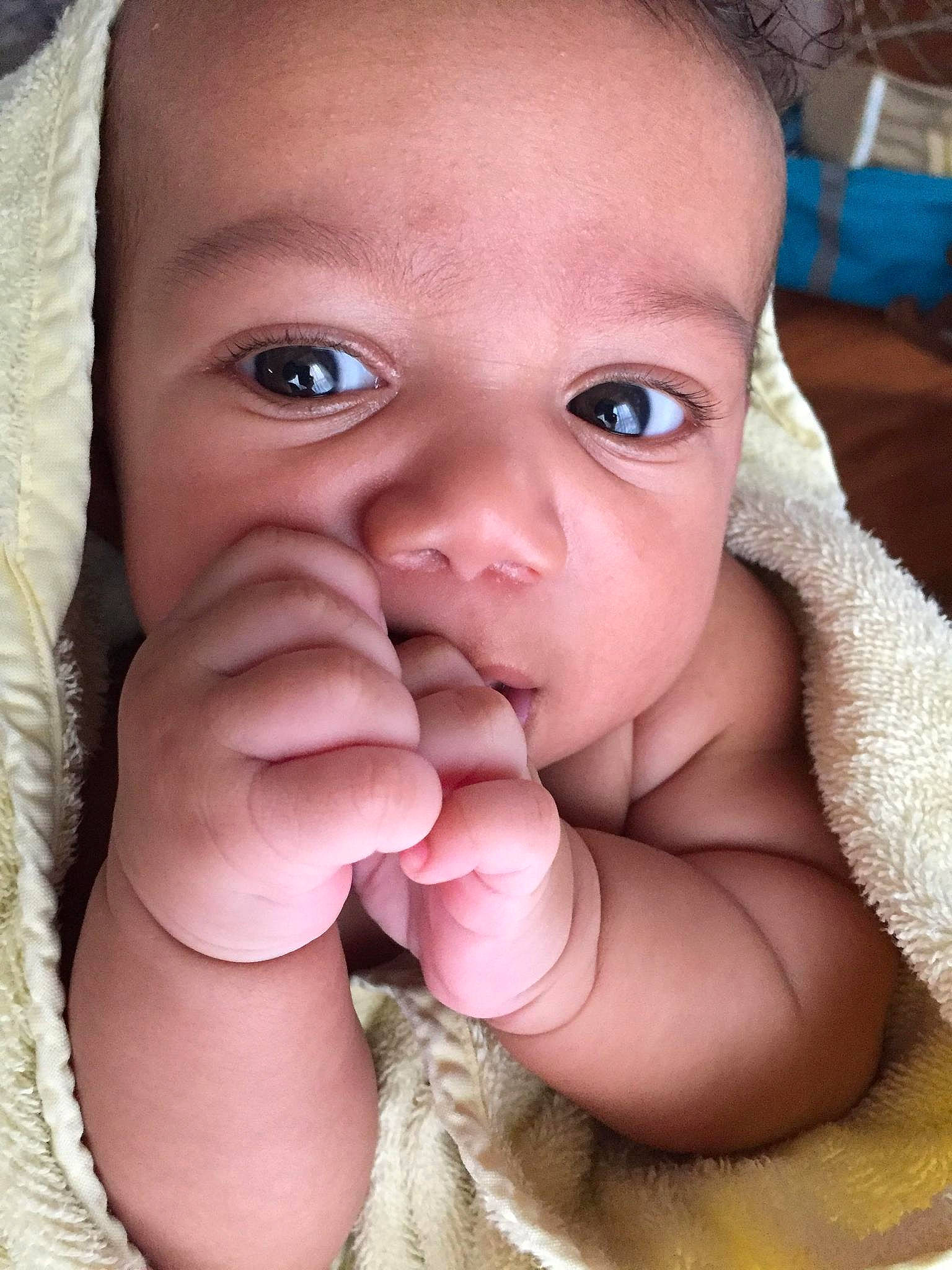 Brison is registered to the contest to win money with this photo: baby, beauty, cheek, child, chin, close_up, eye, eyebrow, face, finger, forehead, hand, head, lip, mouth, muscle, nose, organ, person, skin