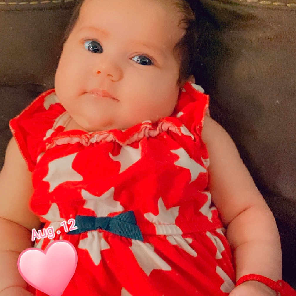 Luna joined the competition — help win amazing prizes! accessories, baby, balloon, bodypart, clothing, couch, cushion, dress, face, finger, furniture, hand, head, homedecor, newborn, person, photography, portrait, sitting, toy