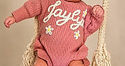 Jaylyn joined the competition — help win amazing prizes! adorable, baby, bow, child, cute, expression, face, feet, hands, headwear, indoors, infant, knitwear, pink_clothing, portrait, ropes, sitting, studio, swing, wooden_swing