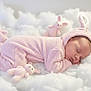 Mira a rejoint le concours — aidez-le/la à gagner de superbes lots ! baby, sleeping, pink_bunny_onesie, plush_toys, soft_texture, cloud_like_surface, cute, infant, child, costume, bunny_ears, peaceful, resting, fluffy, adorable, portrait, childhood, soft_lighting, indoor, cozy
