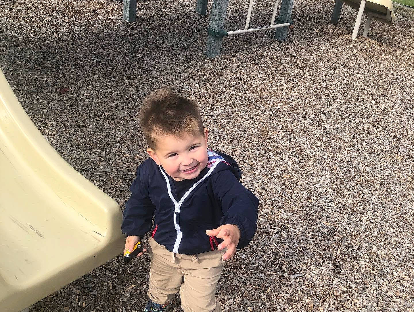 Malakai is registered to the contest to win money with this photo: asphalt, baby, baby_toddler_clothing, child, city, flooring, fun, grass, happy, joy, leisure, people_in_nature, person, play, recreation, road_surface, sitting, sleeve, smile, soil