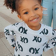 Kolbi is registered to the contest to win money with this photo: blackhair, blouse, child, clothing, face, female, footwear, girl, hair, happy, head, jeans, pants, person, photography, portrait, shoe, sleeve, smile, t_shirt