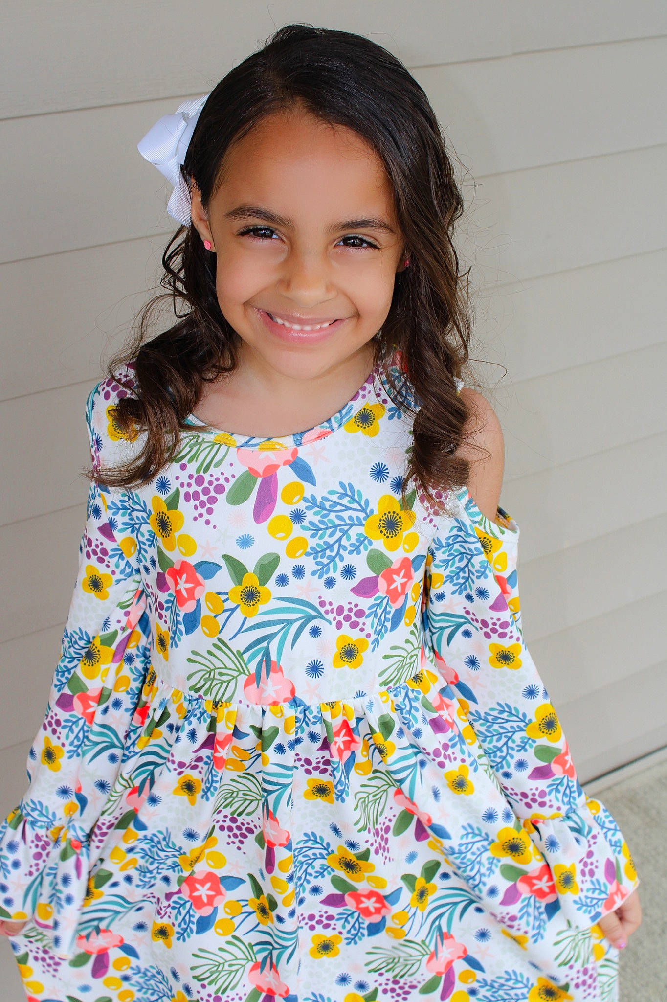 Lamiya is registered to the contest to win money with this photo: baby_toddler_clothing, child, child_model, clothing, day_dress, design, dress, joy, one_piece_garment, pattern, person, sleeve, smile, textile, toddler, yellow