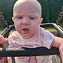 Tallulah joined the competition — help win amazing prizes! baby, casual_clothing, child, closeup, cute, daylight, dribble, facial_expression, floral_outfit, greenery, infant, metal_chains, outdoor, park, person, play_equipment, playground, summer, sunlight, swing