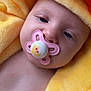 baby, blanket, child, closeup, comfort, cute, expression, face, head, infant, orange, pacifier, portrait, rest, skin, sleepy, soft_texture, warm, yellow, young