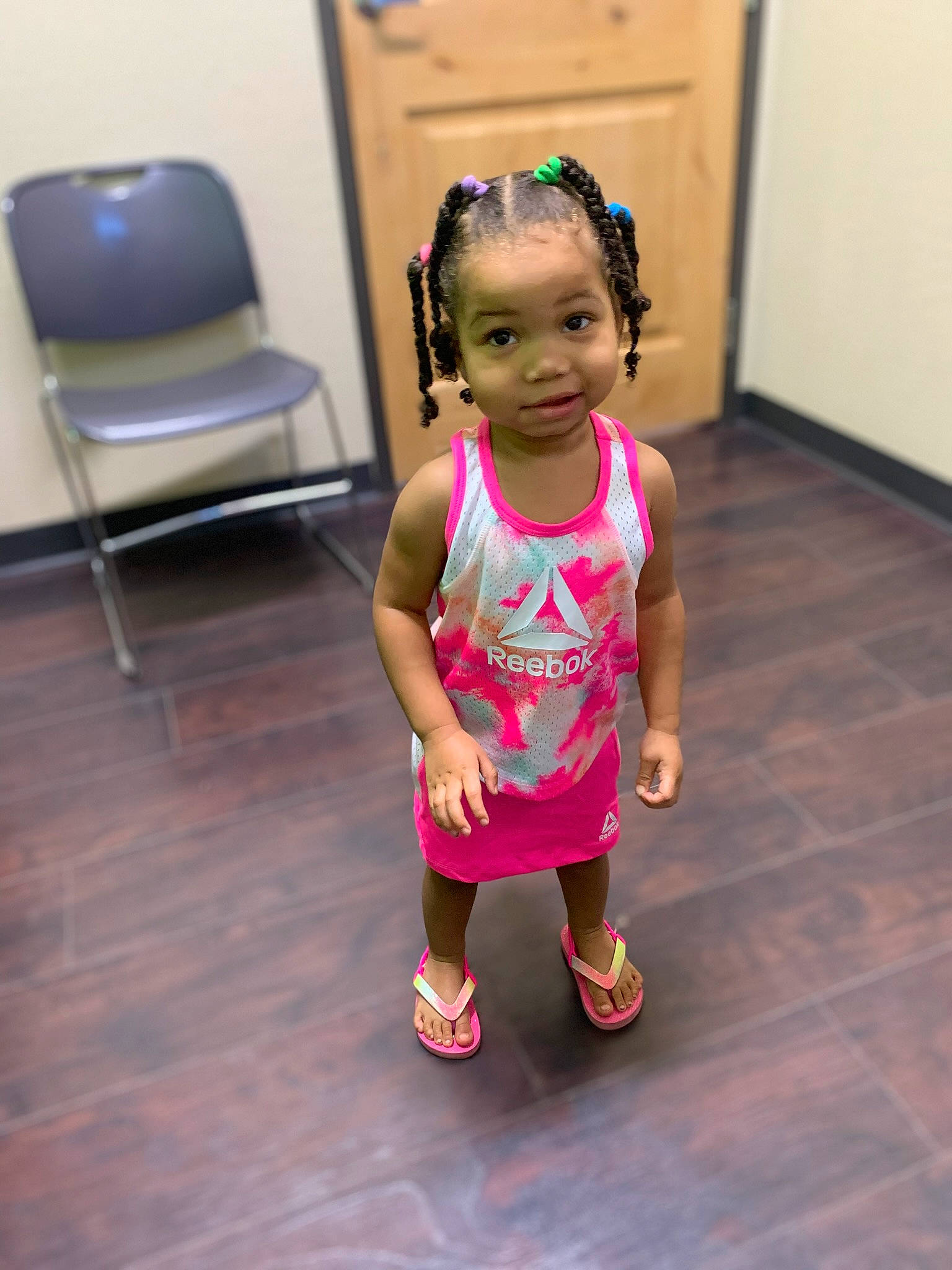 Treasure joined the competition — help win amazing prizes! baby_toddler_clothing, chair, child, event, eye, floor, flooring, fun, happy, hardwood, human_leg, leisure, magenta, person, room, sandal, shorts, sitting, t_shirt, toddler