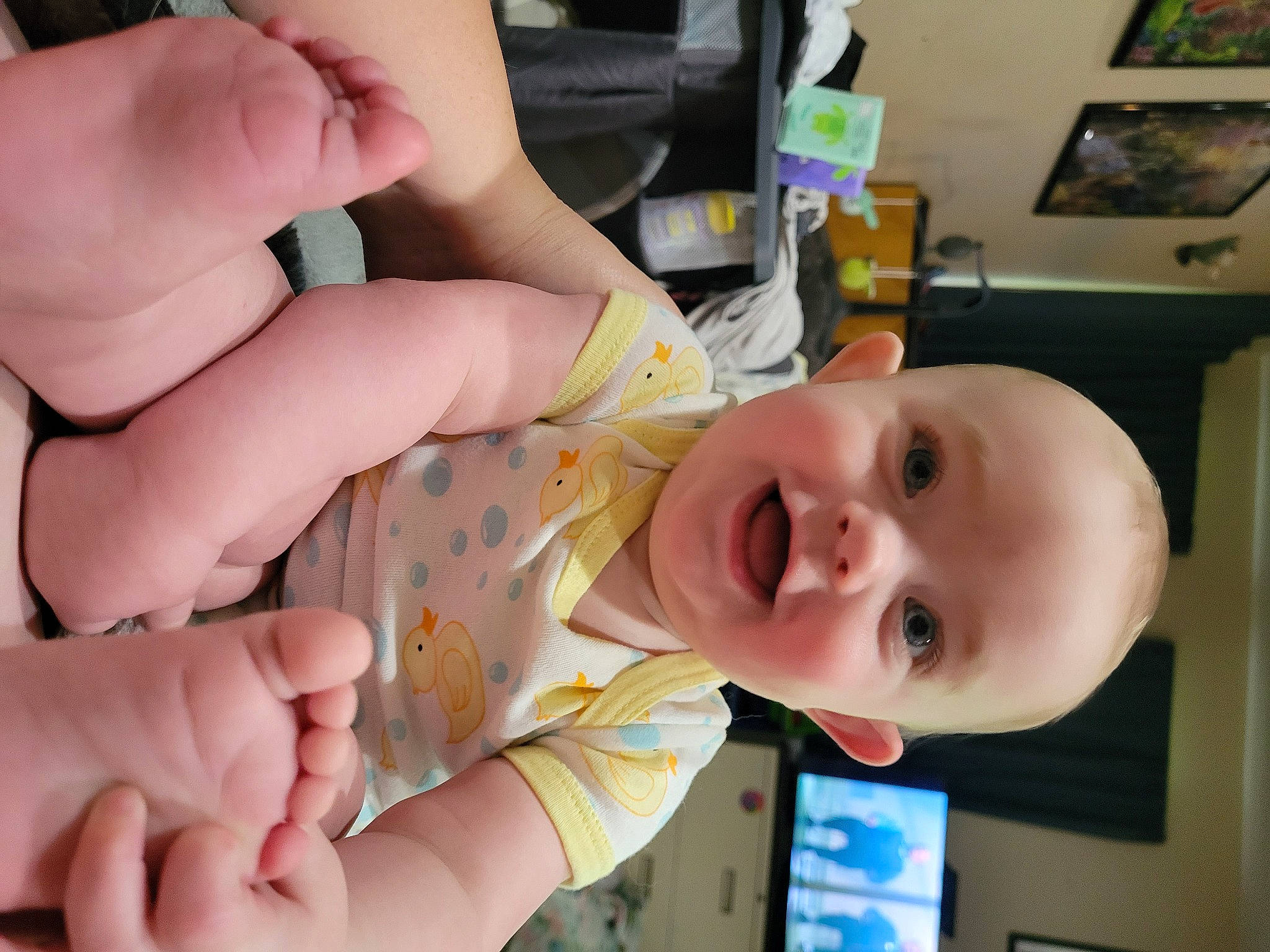 Maryann is registered to the contest to win money with this photo: baby, baby_products, baby_toddler_clothing, cheek, child, ear, eye, finger, foot, fun, gesture, hand, happy, head, nail, nose, person, picture_frame, smile, thumb