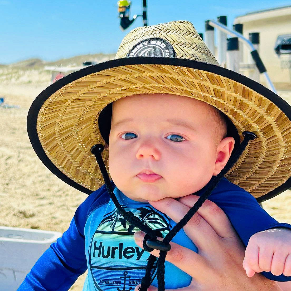 Rhett is registered to the contest to win money with this photo: baby, baby_toddler_clothing, blue, chin, cool, eye, fun, happy, hat, headgear, headwear, leisure, people, person, photograph, skin, sky, standing, summer, sun_hat