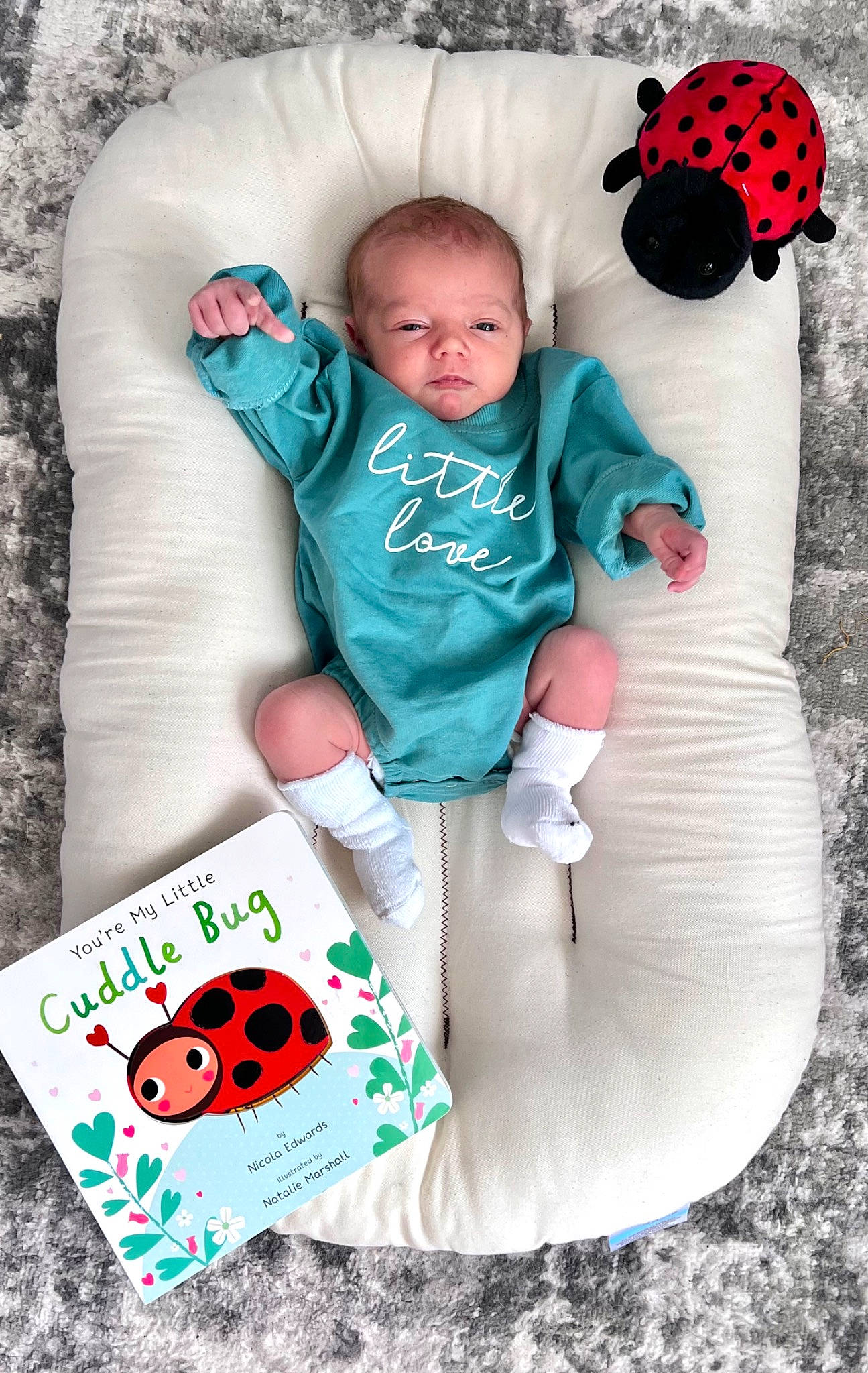 Rhett is registered to the contest to win money with this photo: baby, baby_toddler_clothing, chair, child, comfort, face, grass, green, happy, leaf, mammal, person, pink, product, red, sleeve, t_shirt, textile, toddler, vertebrate