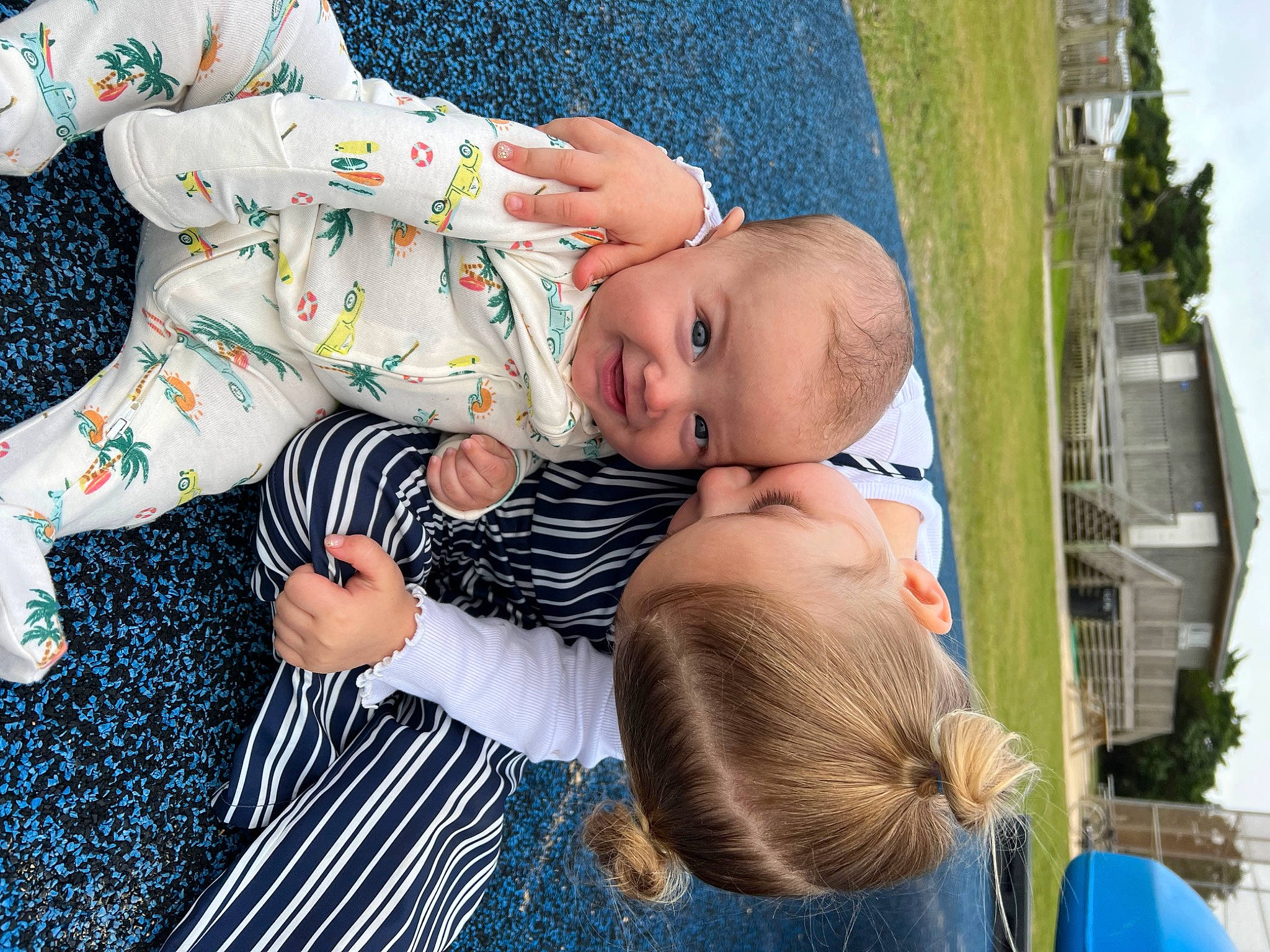 Rhett is registered to the contest to win money with this photo: baby, baby_products, baby_toddler_clothing, blue, child, dress, fun, grass, happy, hat, joy, leisure, pattern, people_in_nature, person, plant, sitting, sky, sun_hat, toddler