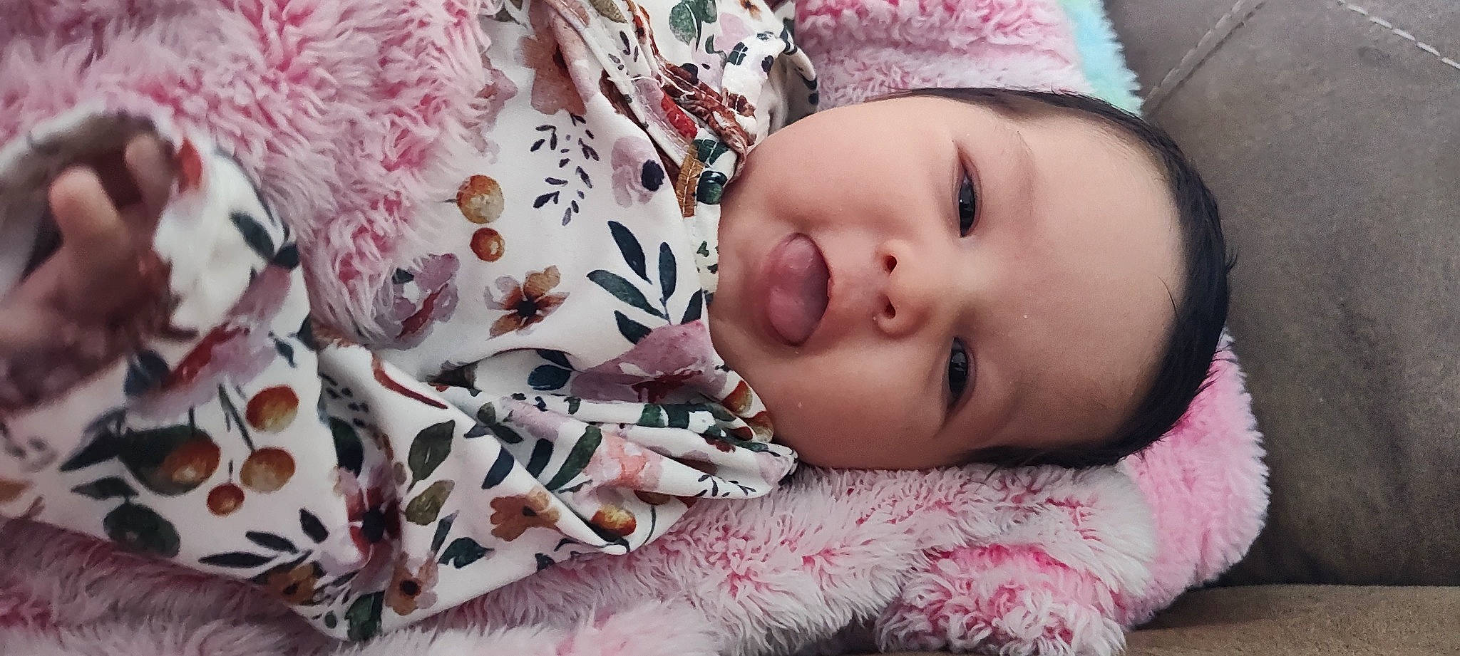 Andrea is registered to the contest to win money with this photo: baby, baby_toddler_clothing, cheek, close_up, comfort, eye, eyelash, fashion_accessory, happy, knit_cap, linens, lip, magenta, nose, pattern, person, pink, skin, textile, toddler