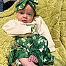 Kiely joined the competition — help win amazing prizes! baby, infant, child, green_clothing, headband, blanket, shamrocks, cute, playful, tongue_out, foot, sitting, indoors, soft_texture, cozy, portrait, young_child, smiling, relaxed, fabric