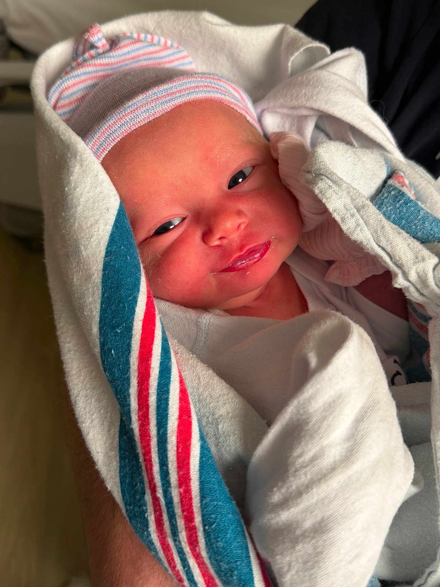 Kiely joined the competition — help win amazing prizes! newborn, baby, infant, child, blanket, hospital, wrapped, cap, face, skin, person, cute, small, sleepy, hand, closeup, portrait, fresh, newborn_clothing, lying