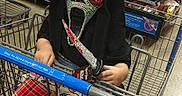 Elizabeth joined the competition — help win amazing prizes! child, shopping_cart, store, mask, scary_mask, toy_knife, adult, man, plaid_pants, socks, aisle, shopping, retail, costume, funny, grocery_store, person, indoor, holding, casual_clothing