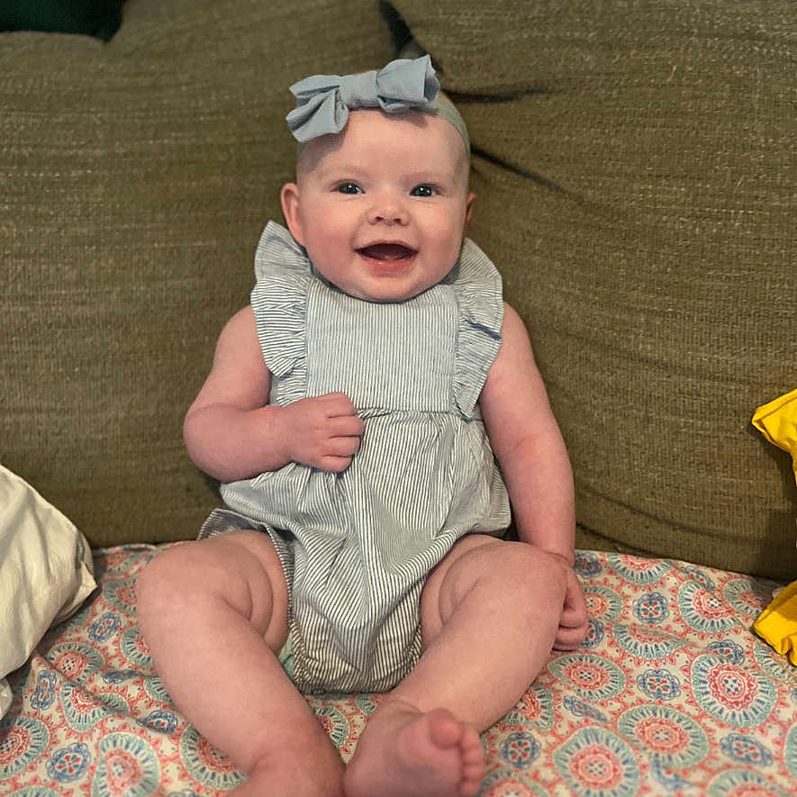 Alliyah is registered to the contest to win money with this photo: baby, bed, bodypart, clothing, couch, cushion, face, finger, furniture, hand, happy, hat, head, homedecor, newborn, person, photography, portrait, sitting, smile