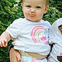 Hayley is registered to the contest to win money with this photo: toddler, child, pouty_face, white_shirt, rainbow_design, shorts, outdoor, greenery, holding, hand, person, cute, nature, summer, casual_clothing, portrait, baby, happy, young_child, skin
