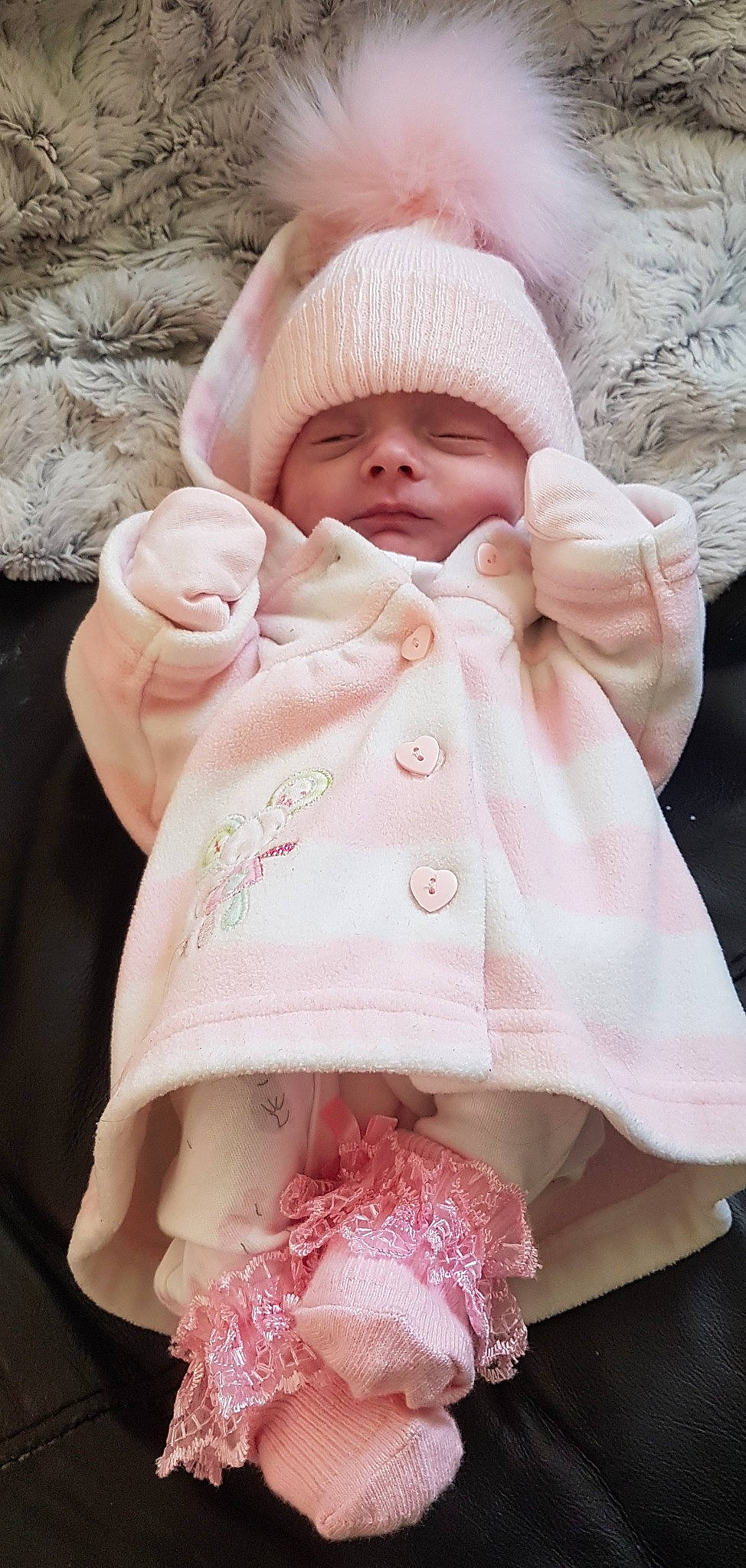 Lacey is registered to the contest to win money with this photo: baby, baby_products, baby_sleeping, baby_toddler_clothing, carmine, cheek, child, comfort, headgear, headwear, human_body, knit_cap, linens, peach, person, pink, service, skin, textile, thumb