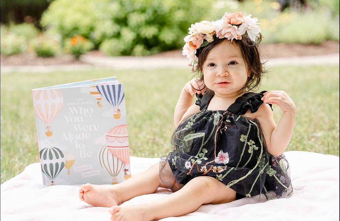 Aveluna is registered to the contest to win money with this photo: child, dress, facial_expression, fashion_accessory, flash_photography, flower, fun, grass, happy, headband, headpiece, headwear, human_leg, jewellery, leisure, people_in_nature, person, petal, pink, plant