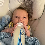 James is registered to the contest to win money with this photo: baby, bed, beverage, blanket, bottle, can, cushion, drinking, face, furniture, head, homedecor, milk, newborn, person, photography, portrait, sleeping, tin, waterbottle