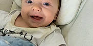 James joined the competition — help win amazing prizes! baby, bed, blanket, clothing, couch, cushion, face, furniture, happy, head, homedecor, laughing, newborn, pants, person, photography, portrait, sleeping, smile, t_shirt