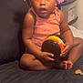baby, ball, couch, cushion, electronics, face, flower, football, furniture, head, homedecor, indoors, person, photography, plant, portrait, sitting, soccer, soccerball, sport