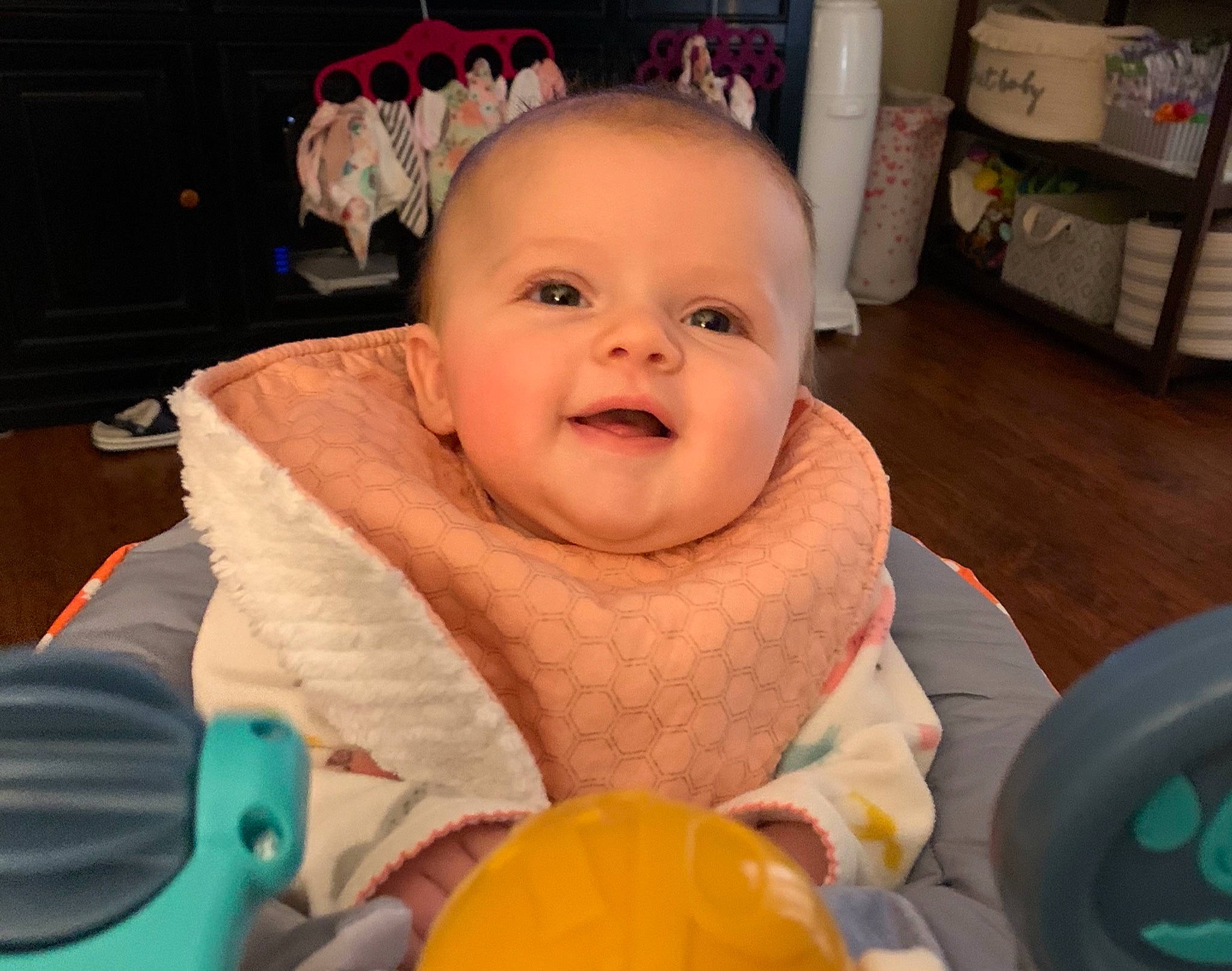 Logann is registered to the contest to win money with this photo: baby, baby_laughing, baby_products, baby_toddler_clothing, baby_toys, child, person, plastic, shelf, shelving, toddler, tongue, tooth