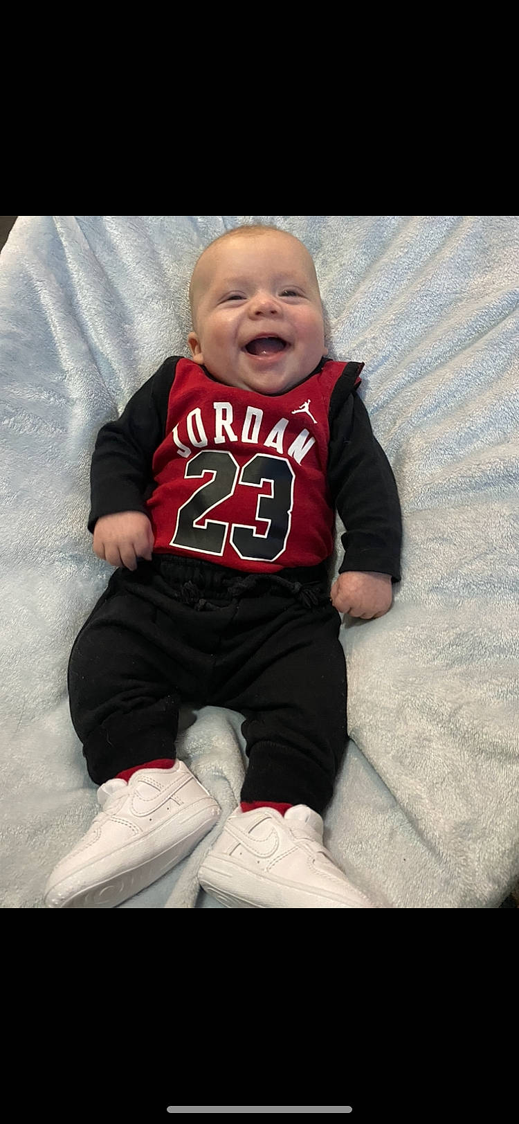 Eli joined the competition — help win amazing prizes! arm, baby, baby_toddler_clothing, child, comfort, cool, eye, face, finger, flash_photography, happy, head, jersey, pattern, person, sleeve, smile, sportswear, t_shirt, textile