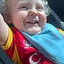 toddler, child, smiling, curly_hair, blue_eyes, car_seat, bib, red_shirt, yellow_shirt, happy, portrait, indoor, closeup, baby, clothing, seatbelt, cute, person, infant, sunlight