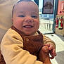 Oakley joined the competition — help win amazing prizes! baby, smiling, indoor, child, person, corduroy, clothing, happy, face, tongue, holding, sleeve, button, window, sunlight, fire_extinguisher, background, hand, portrait, cute