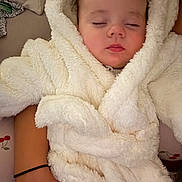 Oakley joined the competition — help win amazing prizes! baby, sleeping, fluffy_robe, white_clothing, peaceful, child, infant, soft_texture, close_up, portrait, resting, comfort, warm, cuddly, indoor, person, arm, skin, cozy, relaxed