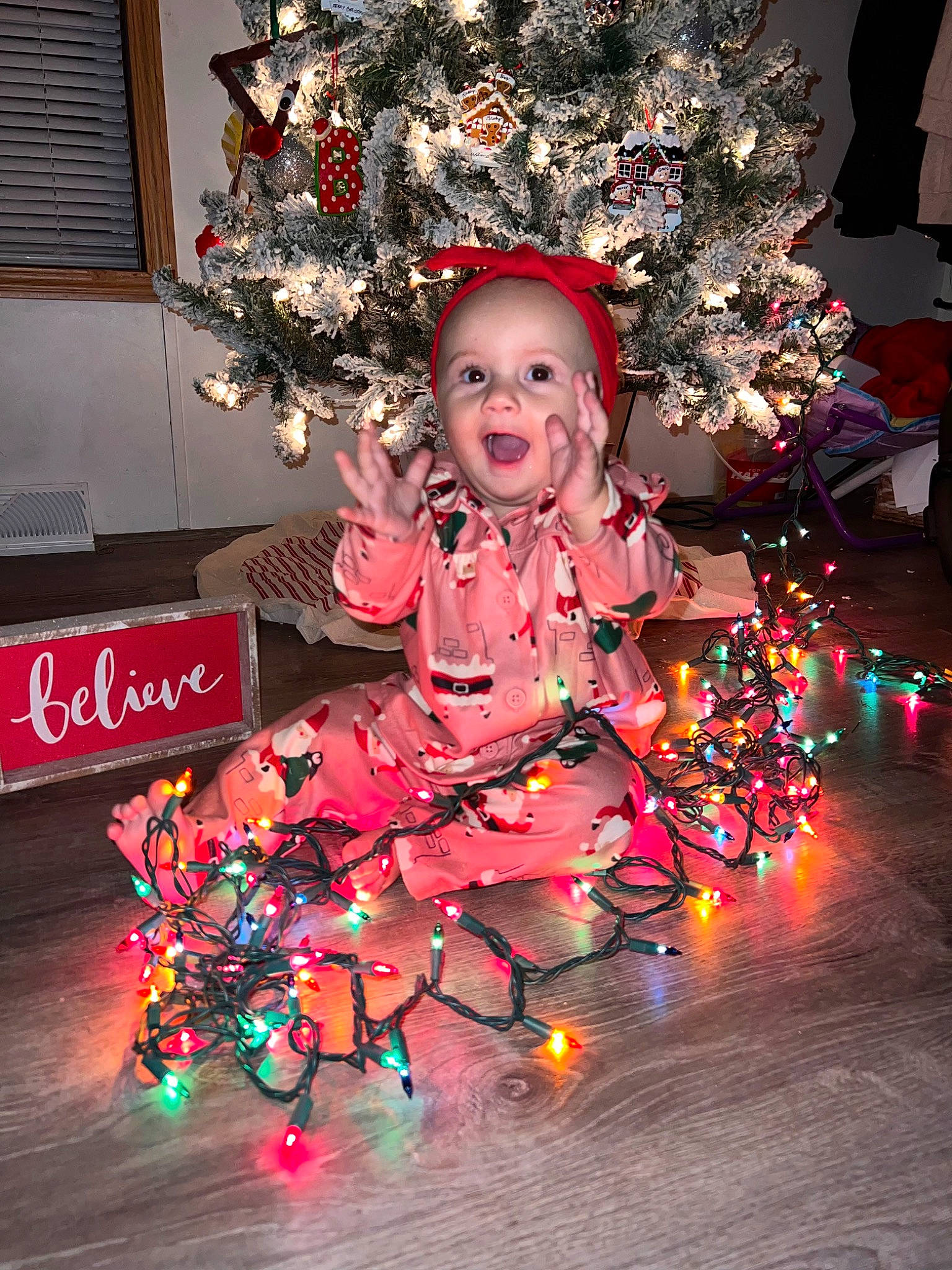 Khalani joined the competition — help win amazing prizes! carmine, christmas, christmas_decoration, christmas_eve, christmas_ornament, christmas_tree, event, fun, happy, holiday, holiday_ornament, interior_design, magenta, ornament, person, pink, plant, smile, toddler, tradition