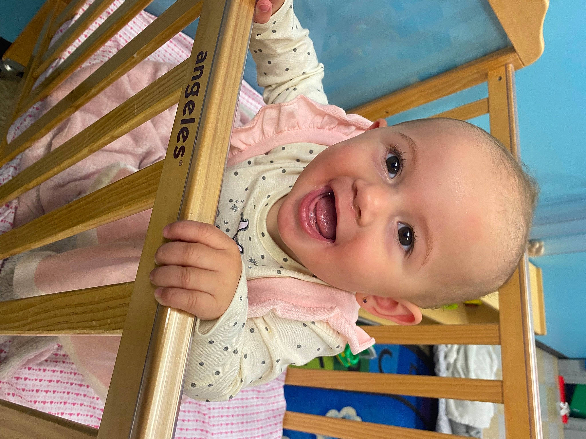 Khalani is registered to the contest to win money with this photo: arm, baby_safety, baby_toddler_clothing, cheek, chin, eye, finger, fun, hair, hand, happy, human_body, iris, nose, person, product, skin, smile, standing, toddler