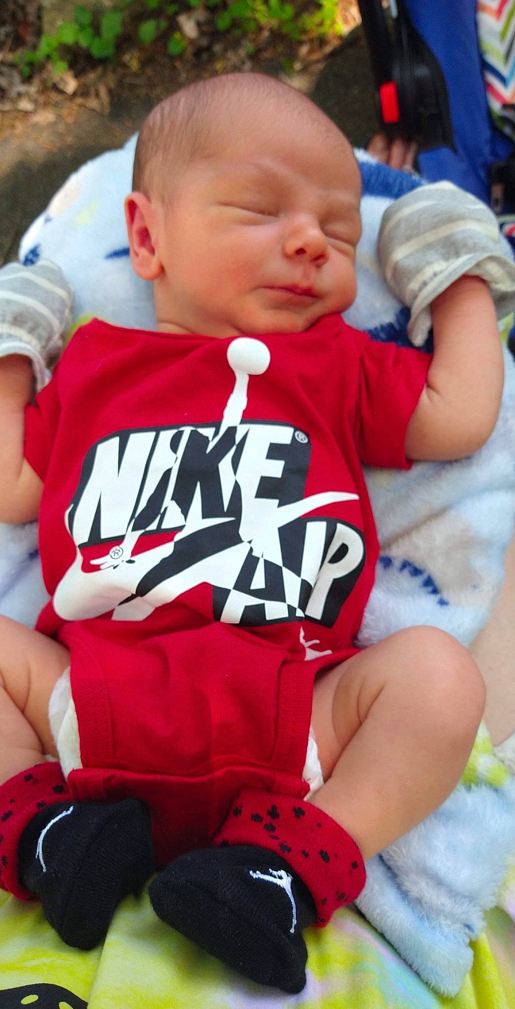 Elijah is registered to the contest to win money with this photo: baby, baby_toddler_clothing, child, cool, finger, fun, grass, happy, headgear, jersey, joint, knee, muscle, orange, person, shorts, sleeve, sportswear, t_shirt, thigh