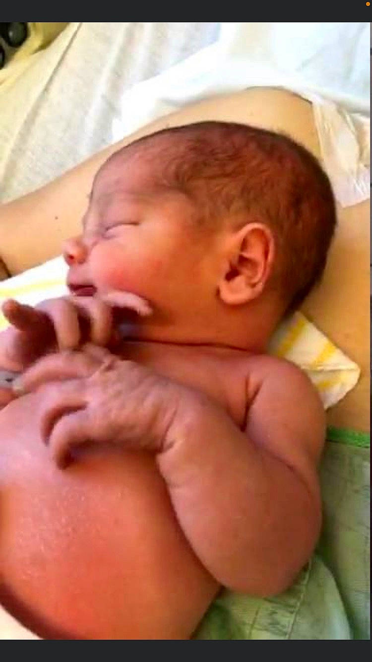 Elijah is registered to the contest to win money with this photo: abdomen, arm, baby, cheek, chest, child, chin, comfort, eyelash, gesture, human_body, mouth, nail, neck, nose, person, skin, stomach, thumb, toddler