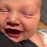 Isaiah is registered to the contest to win money with this photo: newborn, baby, infant, sleeping, face, portrait, close_up, open_mouth, eyes_closed, snuggled, caregiver, black_clothing, indoor, candid, skin, cheeks, nose, mouth, cozy, photography