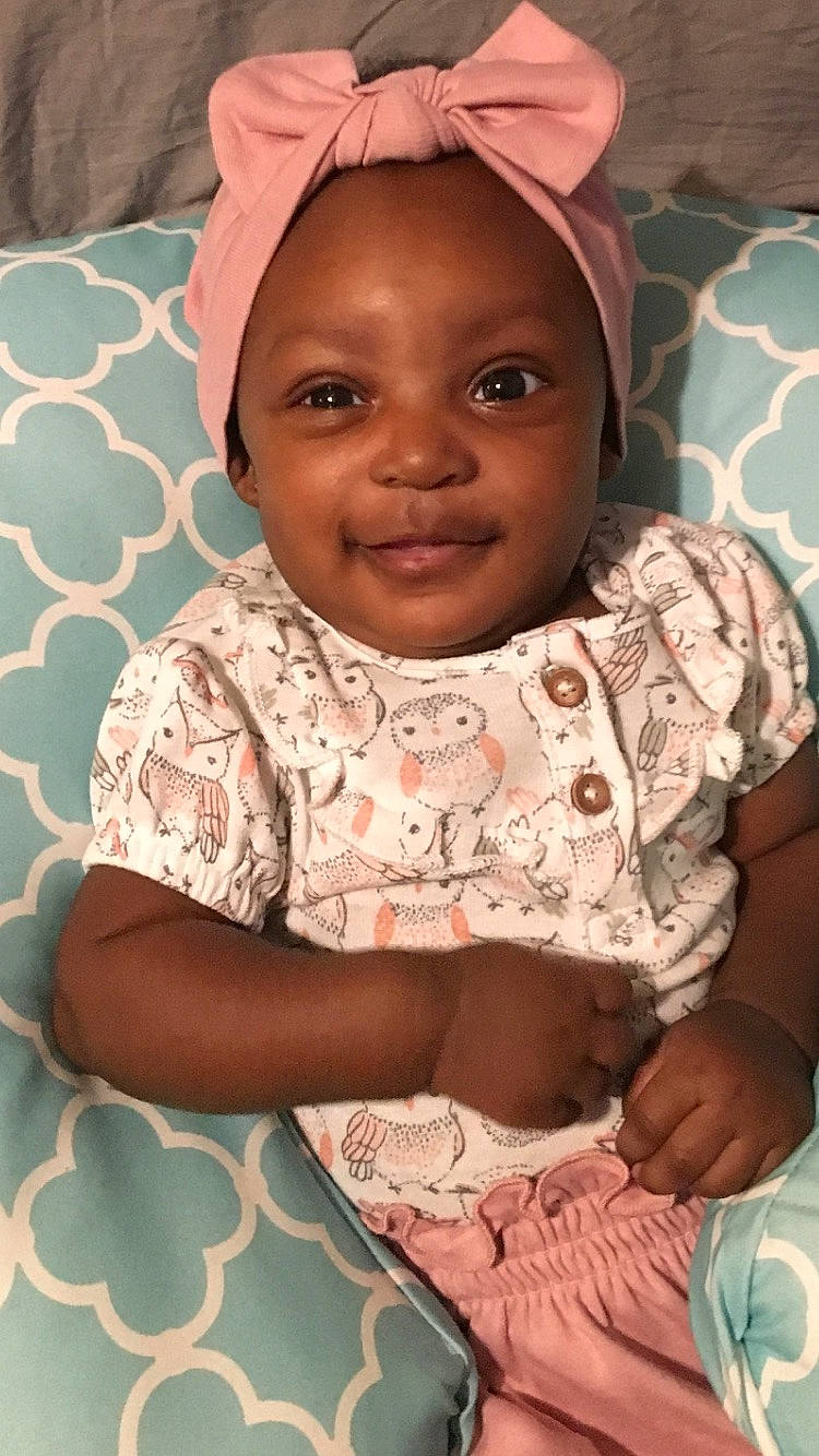 Aubrei is registered to the contest to win money with this photo: adaptation, baby, cheek, child, ear, eye, face, facial_expression, forehead, head, headgear, joy, lip, neck, nose, people, person, pink, skin, smile