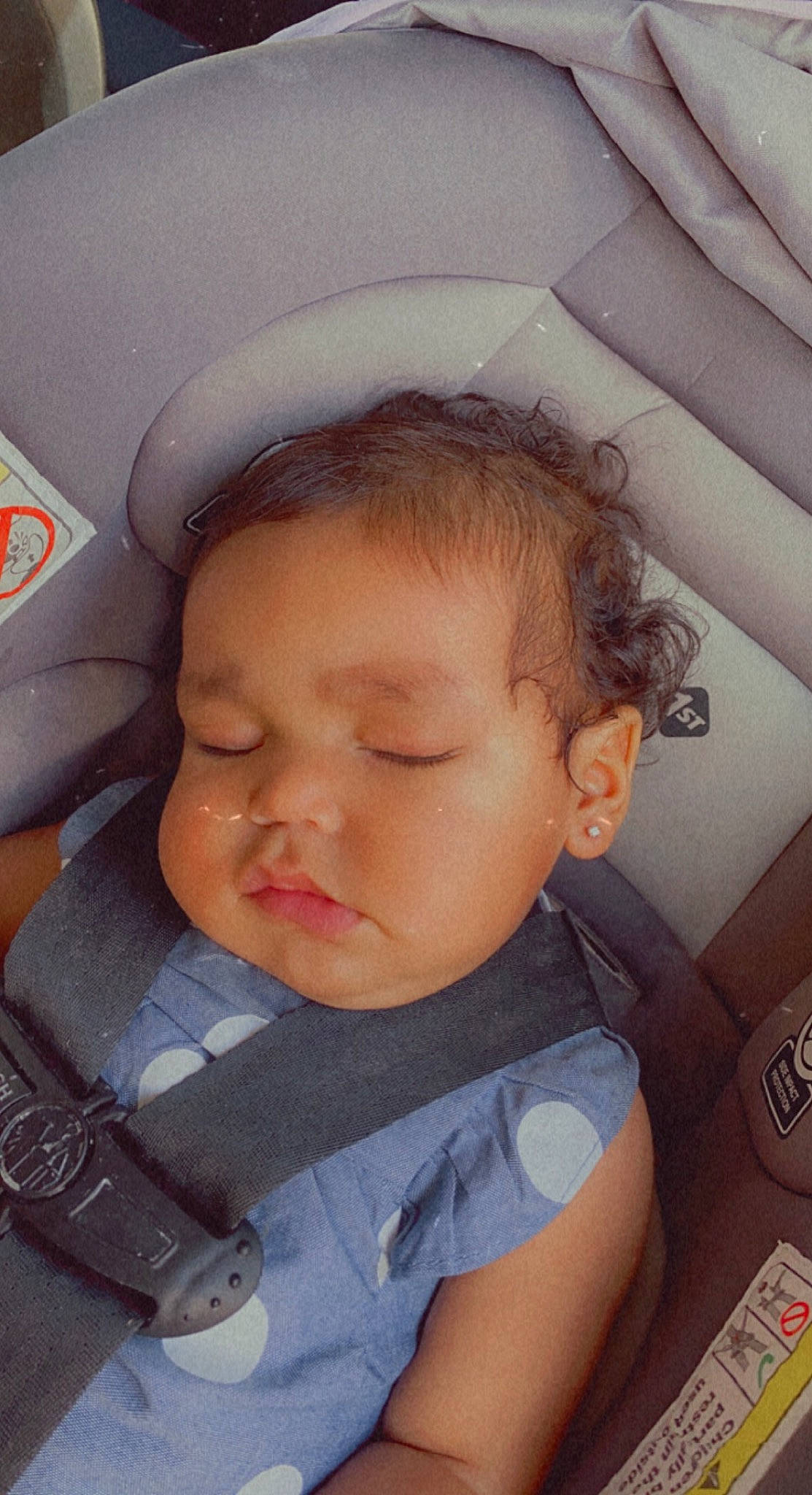 Kiara Love is registered to the contest to win money with this photo: baby, baby_toddler_clothing, car_seat, cheek, chin, comfort, cool, ear, eyelash, finger, hairstyle, happy, head, iris, lip, mouth, nose, person, skin, toddler