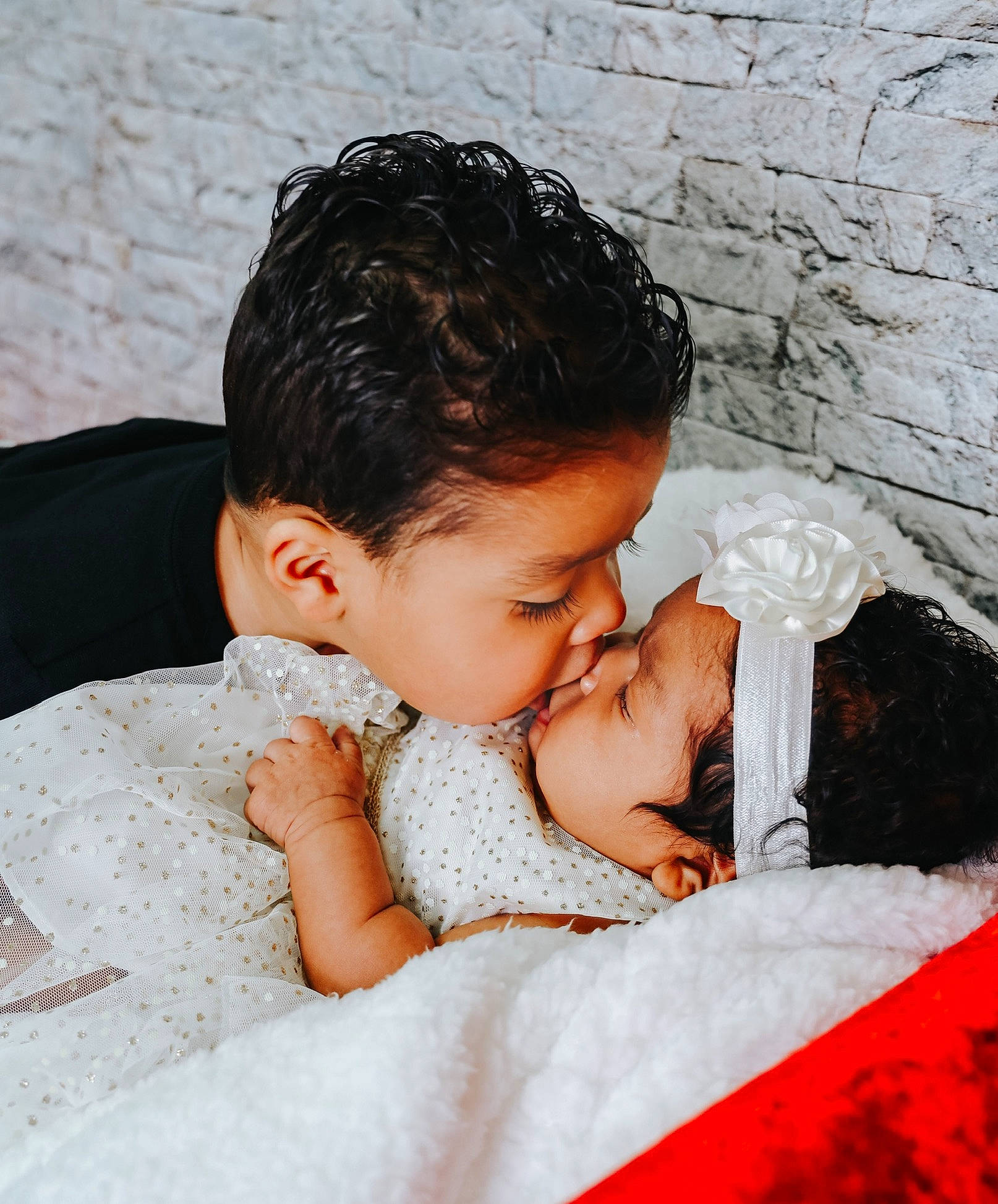 Kiara Love is registered to the contest to win money with this photo: baby, black_hair, child, comfort, flash_photography, fun, fur, gesture, happy, hug, human_body, linens, lip, nose, people_in_nature, person, romance, sitting, skin, textile