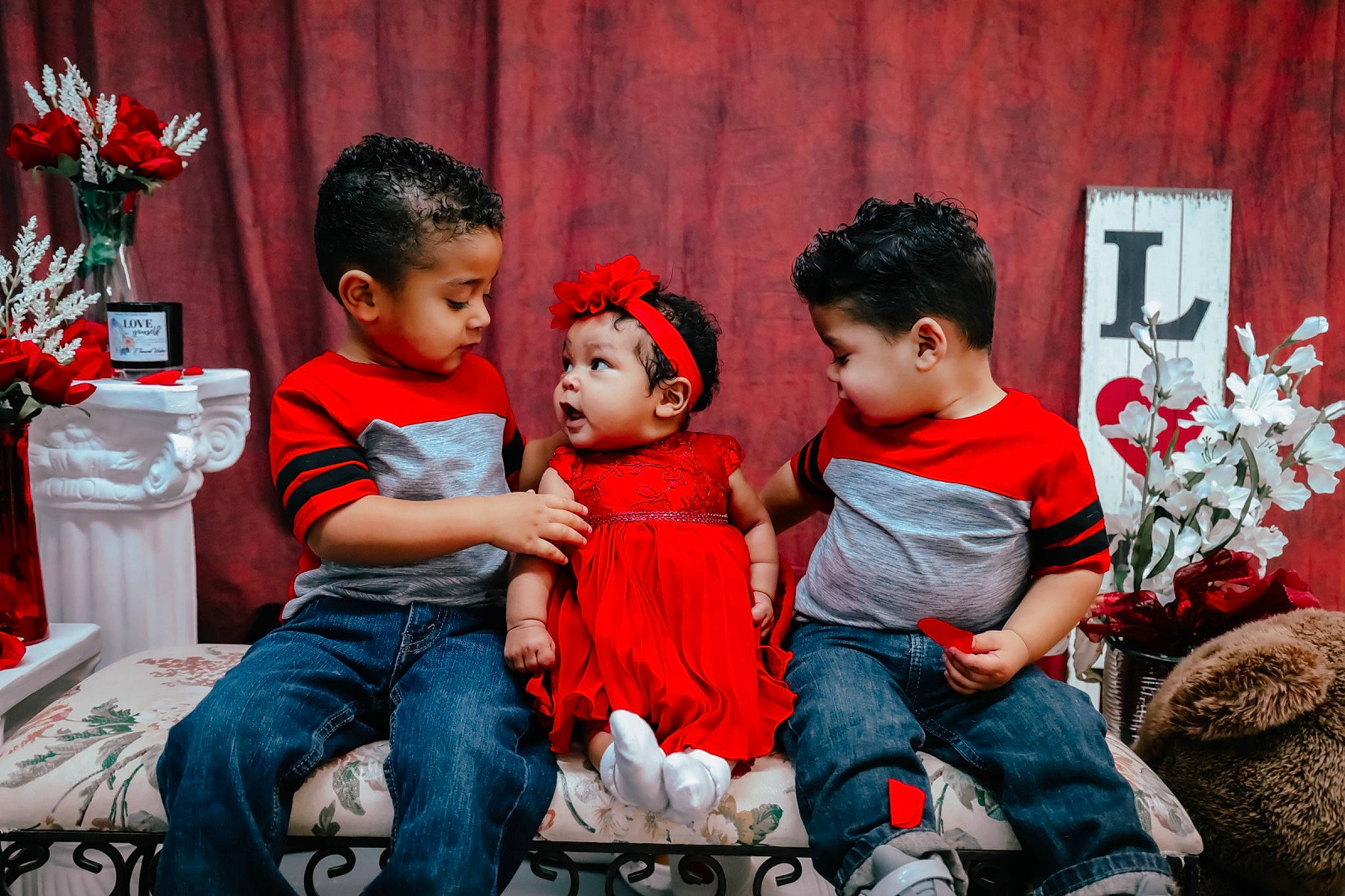 Kiara Love joined the competition — help win amazing prizes! baby, child, couch, curtain, event, fashion, flash_photography, flower, fun, happy, jeans, lap, leisure, living_room, person, plant, red, room, sitting, toddler