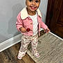 Merlyn joined the competition — help win amazing prizes! toddler, child, smile, indoor, pink_jacket, headband, lollipop, happy, pants, floral_pattern, footwear, wooden_floor, rug, door, white_shirt, person, standing, cute, apparel, portrait