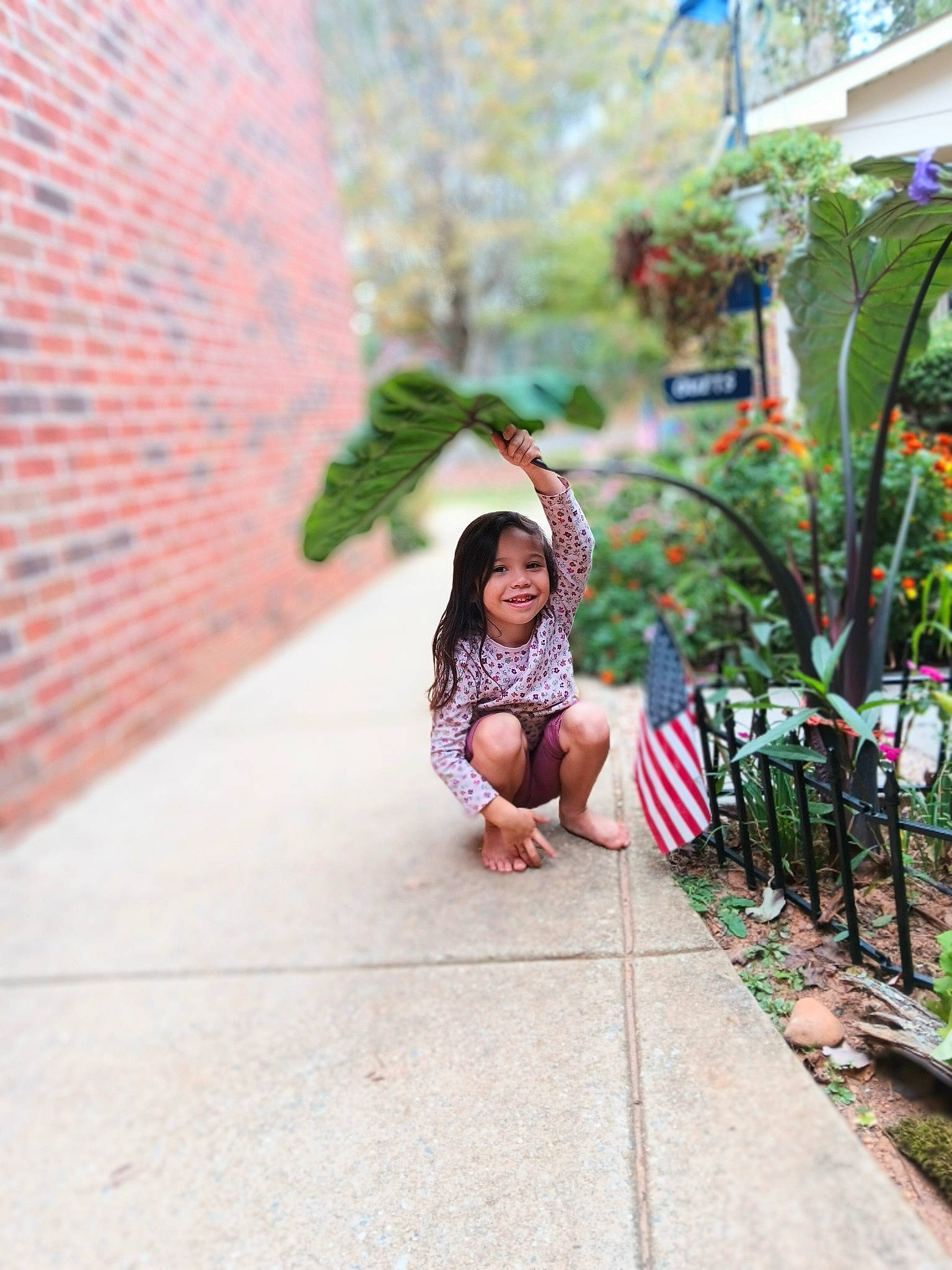 Noel is registered to the contest to win money with this photo: child, event, fun, grass, happy, house, human_leg, joy, leisure, magenta, pedestrian, person, plant, recreation, road, road_surface, sidewalk, smile, street, toddler