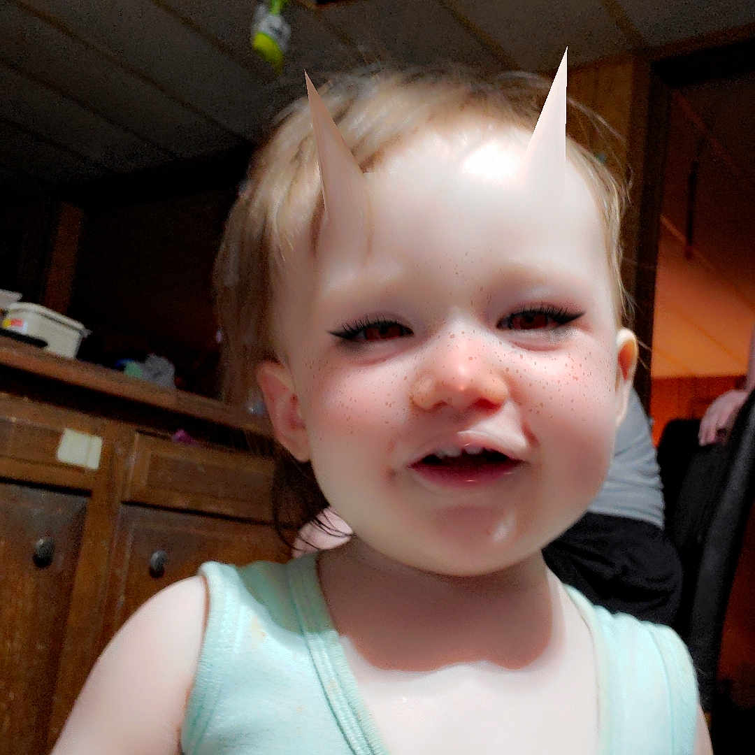 Eclipse joined the competition — help win amazing prizes! background, cabinet, casual_clothing, ceiling, child, clip, face_filter, freckles, hair, indoor, light_skin, pacifier, person, playful, portrait, room, smiling, tank_top, toddler, wooden_furniture