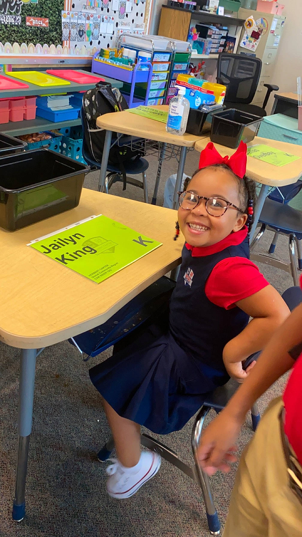 Jailyn is registered to the contest to win money with this photo: adaptation, chair, child, desk, engineering, event, eyewear, fun, furniture, glasses, happy, indoor_games_and_sports, joy, leisure, person, recreation, shorts, smile, t_shirt, table