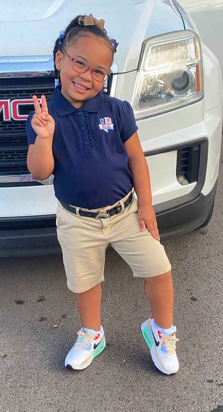 Jailyn is registered to the contest to win money with this photo: automotive_design, automotive_exterior, automotive_lighting, automotive_tire, automotive_wheel_system, bumper, car, electric_blue, eyewear, grille, hood, joy, land_vehicle, motor_vehicle, person, personal_luxury_car, shorts, smile, sneakers, vehicle