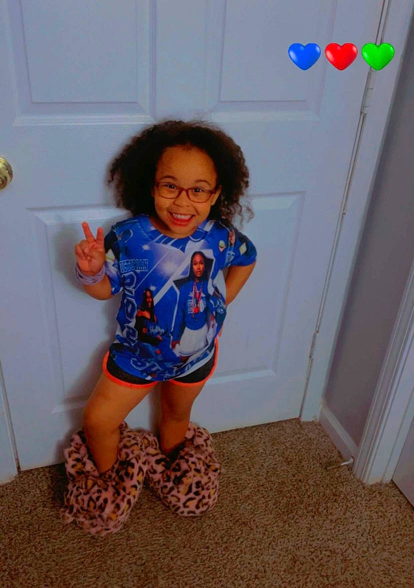 Jailyn joined the competition — help win amazing prizes! baby_toddler_clothing, balloon, child, electric_blue, eyewear, floor, flooring, fun, happy, human_leg, joy, knee, leg, party_supply, pattern, person, shoulder, sleeve, smile, standing