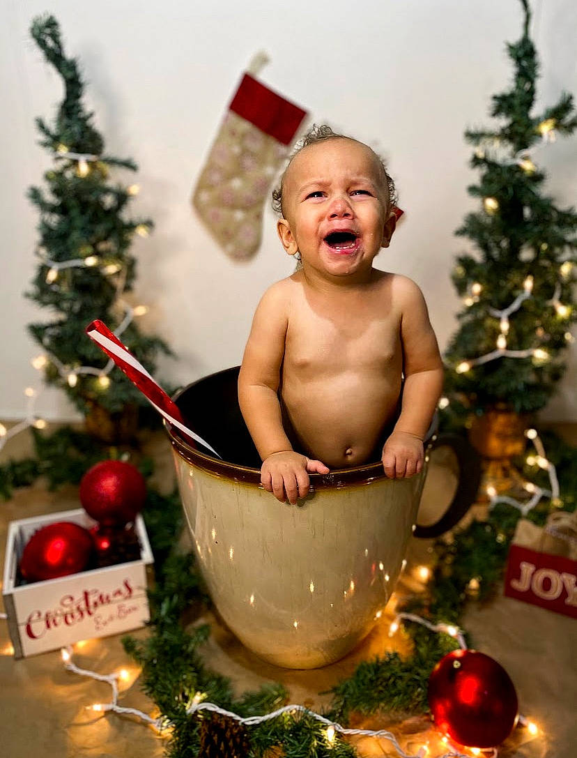 Finn is registered to the contest to win money with this photo: child, christmas, christmas_decoration, christmas_eve, christmas_ornament, christmas_tree, fictional_character, fir, happy, holiday, holiday_ornament, interior_design, ornament, person, photography, pine_family, smile, sorrow, toddler, tree