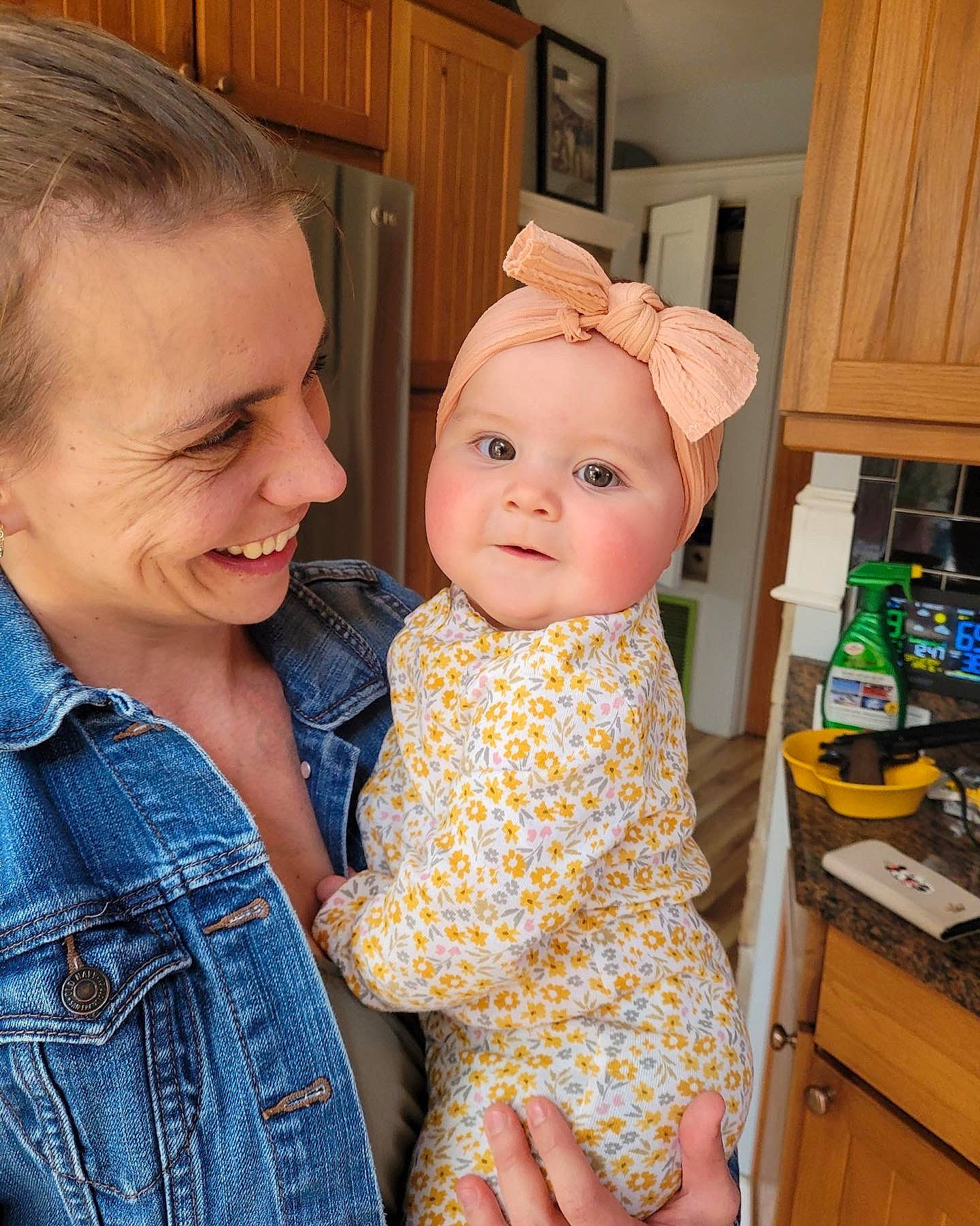 Cecilia is registered to the contest to win money with this photo: baby, baby_toddler_clothing, cabinetry, child, clothing, event, eye, face, fun, hairstyle, happy, headwear, home_appliance, joy, kitchen, kitchen_appliance, one_piece_garment, pattern, person, skin