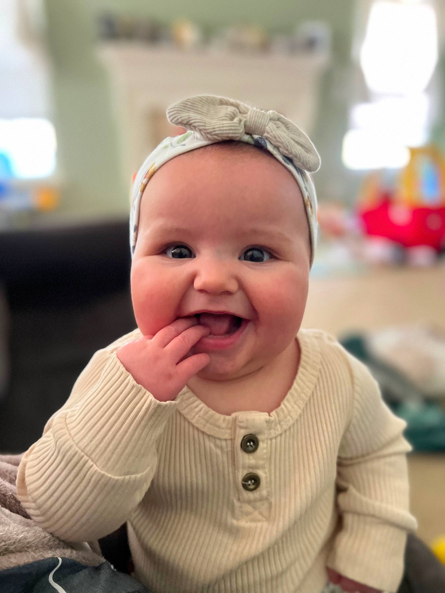 Cecilia is registered to the contest to win money with this photo: baby, baby_toddler_clothing, cheek, child, fashion_accessory, finger, fun, gesture, happy, hat, headwear, iris, joy, lip, nose, person, recreation, sitting, skin, sleeve