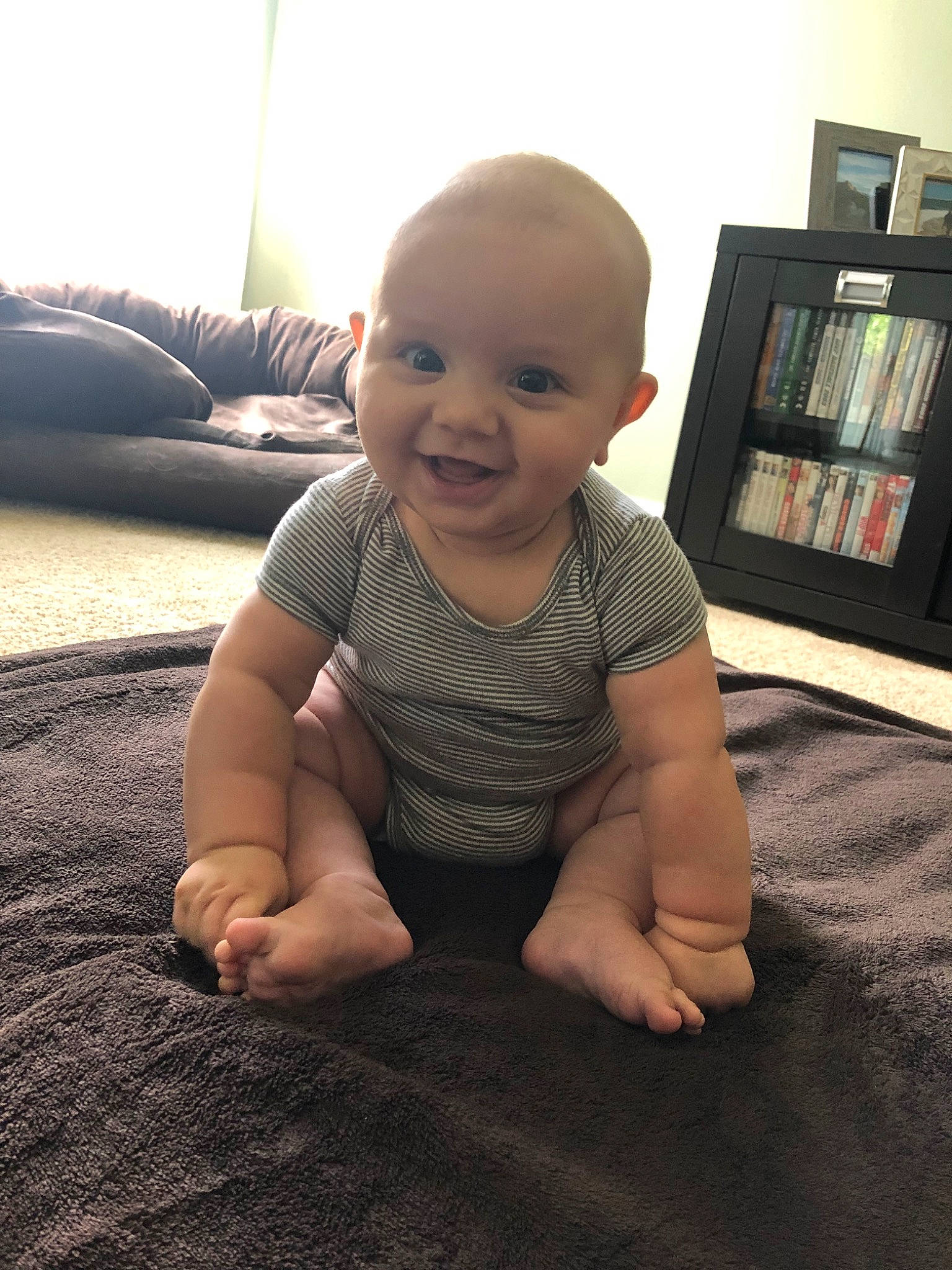 Forrest is registered to the contest to win money with this photo: arm, baby, cheek, child, crawling, face, finger, floor, flooring, hand, head, joint, joy, leg, person, play, sitting, skin, smile, thumb