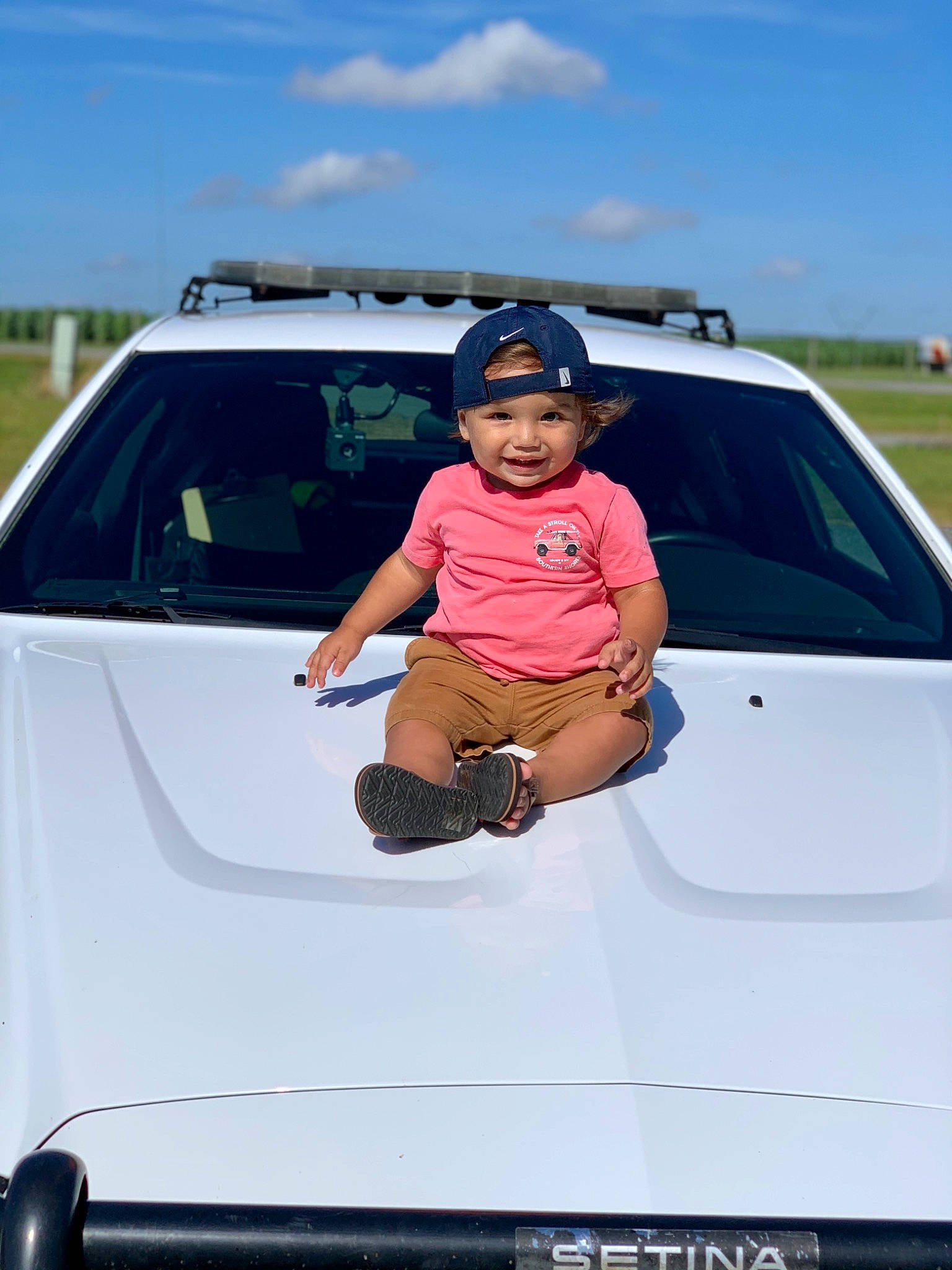 Marcello is registered to the contest to win money with this photo: automotive_design, automotive_exterior, automotive_lighting, automotive_tail_brake_light, automotive_tire, automotive_wheel_system, bumper, car, fender, grille, headwear, hood, joy, motor_vehicle, person, personal_luxury_car, rim, shorts, sky, trunk